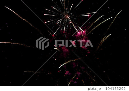 bright colorful fireworks in the night sky. 104123292