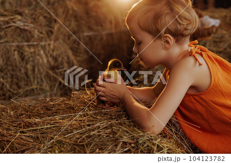 Child holding a duck Child holding a duck 104123782