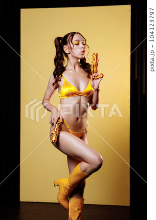 Front view happy young sexy woman in yellow swimsuit 104123797