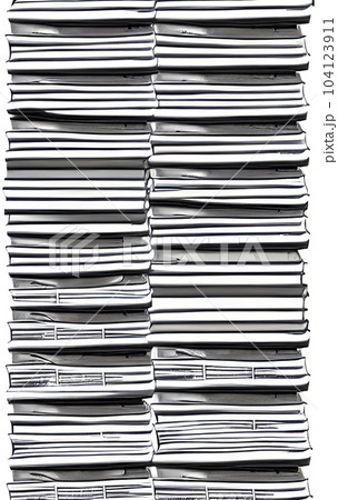 close-up stack of daily newspapers 104123911
