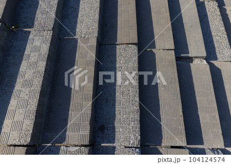 An old damaged staircase in the park 104124574