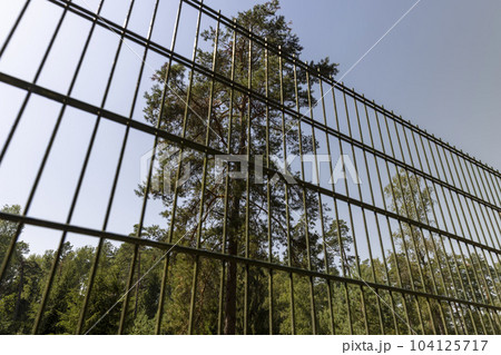 Metal fence to ensure security Metal fence to ensure security 104125717