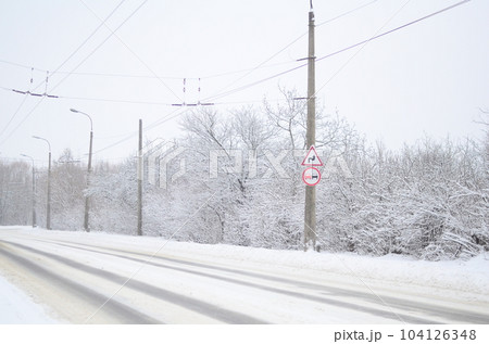 paved road in the winter season 104126348