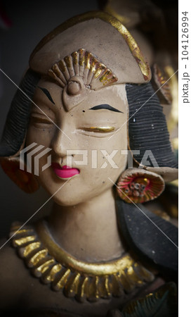 Beautiful artistic statue of a Balinese or javanese dancer used as garden decoration, javanese gnome indonesia Beautiful artistic statue of a Balinese or javanese dancer used as garden decoration, javanese gnome indonesia 104126994