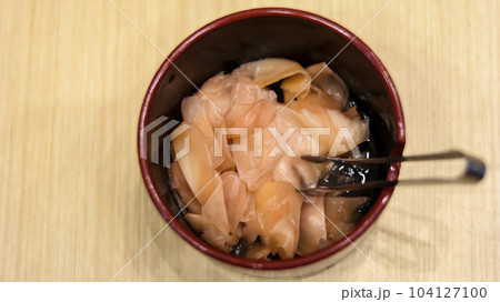 Home made pickled ginger Gari or Japanese ginger sushi pickle at Japanese restaurant. Home made pickled ginger Gari or Japanese ginger sushi pickle at Japanese restaurant. 104127100