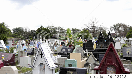 Public cemetery with varied graves. Public cemetery with varied graves. 104127384