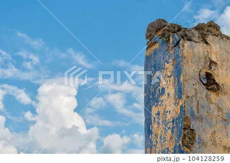 The ruins of the abandoned Greek city of Levissi near the village of Kayakoy in Fethiye Turkey, against the backdrop of cumulus clouds, the tragedy of wars. Site of the ancient city of Karmilissos The ruins of the abandoned Greek city of Levissi near the village of Kayakoy in Fethiye Turkey, against the backdrop of cumulus clouds, the tragedy of wars. Site of the ancient city of Karmilissos 104128259