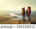 Two hikers with backpacks on a rocky outcrop enjoying the view into the valley - AI content 104128412