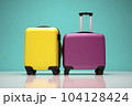 Yellow and purple rolling suitcases against green background - AI content 104128424