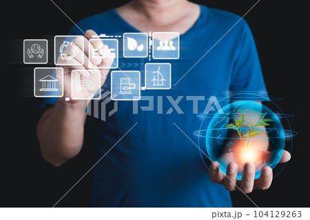 hand touch hologram to save energy,and reduce global warming,climate change,ecology friendly investment,ESG environment social governance,Green Business Innovation and Sustainable Development concept. 104129263