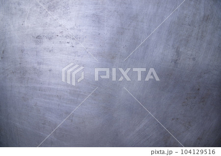Scratched industrial Metalplate surface can be used as a background and texture Scratched industrial Metalplate surface can be used as a background and texture 104129516
