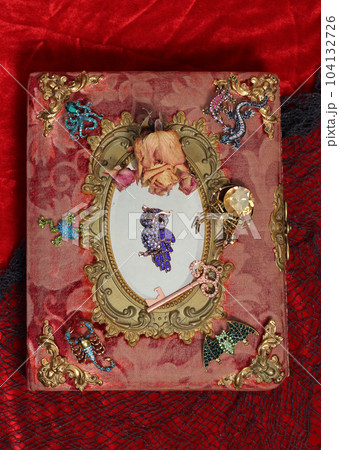 Antique Victorian Era Book With Colorful Gemstones added. Fairy Tale Scary Book With Scorpion and Bat 104132726