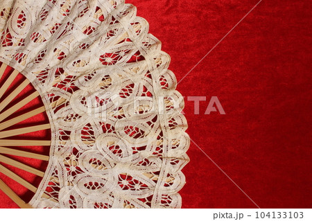 Vintage Lace Hand Fan On Red Velvet Background 104133103