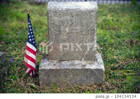 Civil War soldier cemetery grave stone with American Flag Civil War soldier cemetery grave stone with American Flag 104134534