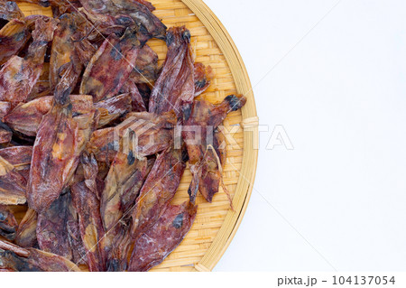 Dried squid on white background. Dried squid on white background. 104137054