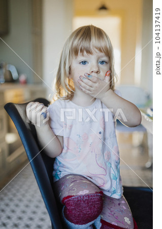 Portrait of little girl with messy hands stained with paint. Portrait of little girl with messy hands stained with paint. 104137419