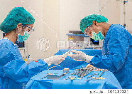 Medical physician doctor or Surgery team in operation room with lighting at hospital Medical physician doctor or Surgery team in operation room with lighting at hospital 104139024