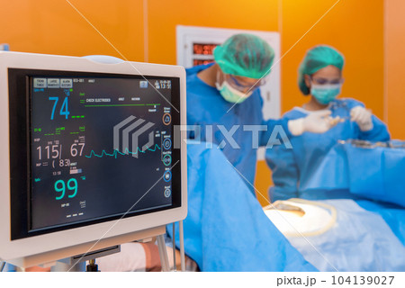 Defibrillator with Medical physician doctor or Surgery team in ICU operation room at hospital Defibrillator with Medical physician doctor or Surgery team in ICU operation room at hospital 104139027