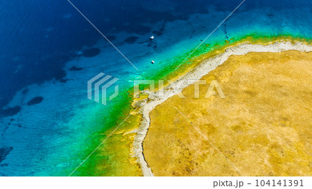 View from the air on the waves and rocks. Sea relaxation and travel. Azure water on the sea. View from the air on the waves and rocks. Sea relaxation and travel. Azure water on the sea. 104141391