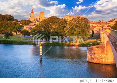 Avignon, Provence, France. Sunset golden hour with Rhone River and medieval city downtown. Avignon, Provence, France. Sunset golden hour with Rhone River and medieval city downtown. 104144067