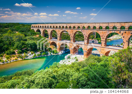 Pont du Gard, France. Ancient three-tiered aqueduct, built in Roman Empire times on the river Gardon, Provence. Pont du Gard, France. Ancient three-tiered aqueduct, built in Roman Empire times on the river Gardon, Provence. 104144068