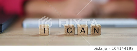 Business woman word I can from cubes in office 104144198