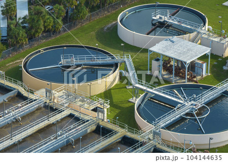 Aerial view of water treatment factory at city wastewater cleaning facility. Purification process of removing undesirable chemicals, suspended solids and gases from contaminated liquid 104144635