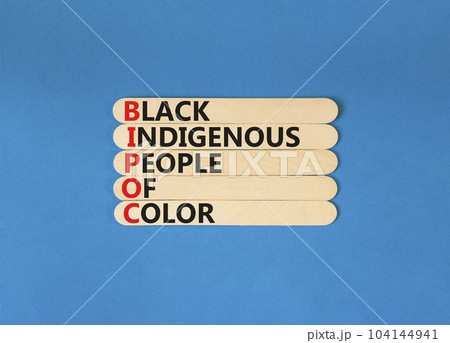 BIPOC black indigenous people of color symbol. Concept words BIPOC black indigenous people of color on wooden stick. Beautiful blue background. Business BIPOC black indigenous people of color concept. BIPOC black indigenous people of color symbol. Concept words BIPOC black indigenous people of color on wooden stick. Beautiful blue background. Business BIPOC black indigenous people of color concept. 104144941