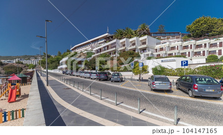Panorama showing the waterfront of the village of Sesimbra timelapse. Portugal Panorama showing the waterfront of the village of Sesimbra timelapse. Portugal 104147165