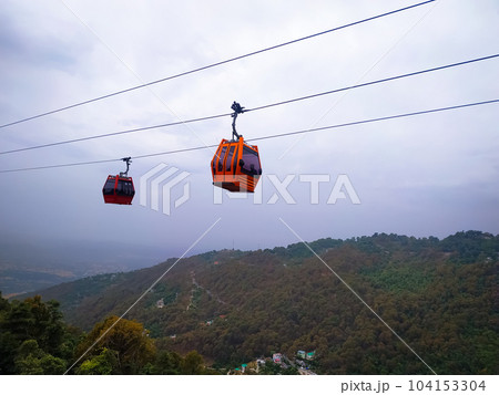 two cable cars running up the mountain two cable cars running up the mountain 104153304