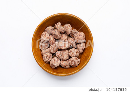 Dried salted Chinese plum on white background 104157656