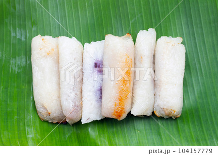 Grilled sticky rice in banana leaves with banana filling 104157779
