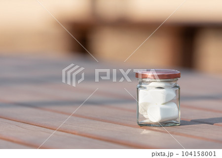 Marshmallows in a glass jar. Marshmallows in a glass jar. 104158001