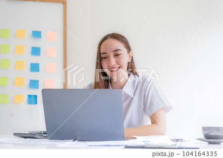 Businesswoman analysis graph at home office for setting challenging business goals and planning to achieve new target Businesswoman analysis graph at home office for setting challenging business goals and planning to achieve new target 104164335