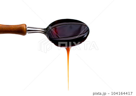Oyster sauce on white background. Oyster sauce on white background. 104164417