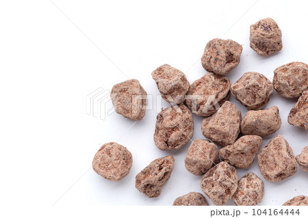 Dried salted Chinese plum isolated on white background 104164444