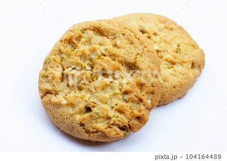 Pistachio and almond cookies on white background. 104164489
