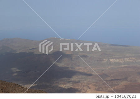 Panoramic view of volcanic lanscape in front of the ocean from the peak of mountain Teide, Tenerife Panoramic view of volcanic lanscape in front of the ocean from the peak of mountain Teide, Tenerife 104167023