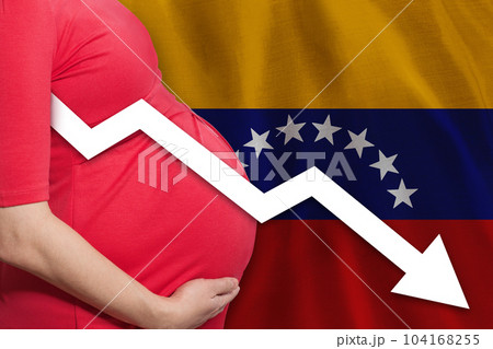 Pregnant woman on Venezuelan flag background. Falling fertility rate in Venezuela 104168255