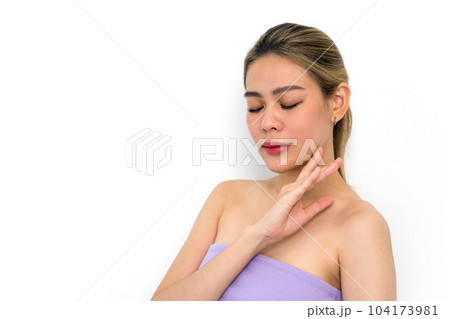 Beautiful young asian woman with clean fresh skin touch her own face . Facial treatment. Cosmetology, beauty and spa. Face care 104173981