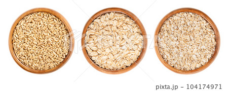 Oat grains, rolled oats and oatmeal, in wooden bowls. Husked common oat, Avena sativa, a cereal grain. Dehusked steamed oat groats, rolled into flat flakes, toasted, used whole or as steel-cut flakes. Oat grains, rolled oats and oatmeal, in wooden bowls. Husked common oat, Avena sativa, a cereal grain. Dehusked steamed oat groats, rolled into flat flakes, toasted, used whole or as steel-cut flakes. 104174971