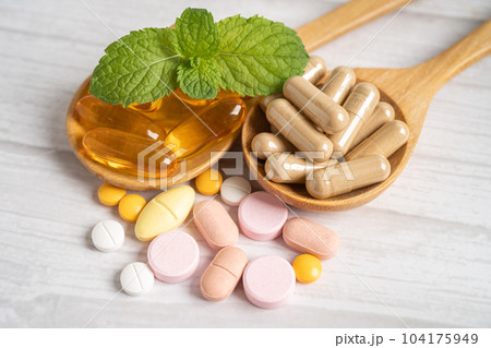 Alternative medicine herbal organic capsule with vitamin E omega 3 fish oil, mineral, drug with herbs leaf natural supplements for healthy good life. 104175949