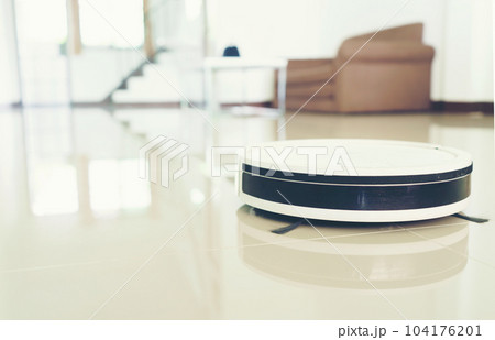 vacuum cleaning robot cleaning the room. 104176201