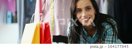 Positive female hairdresser communicates with male client in beauty salon Positive female hairdresser communicates with male client in beauty salon 104177045
