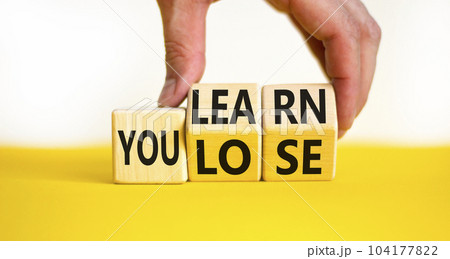 We learn or lose symbol. Concept words We learn and We lose on wooden cubes. Businessman hand. Beautiful yellow table white background. Business and we learn or lose concept. Copy space. We learn or lose symbol. Concept words We learn and We lose on wooden cubes. Businessman hand. Beautiful yellow table white background. Business and we learn or lose concept. Copy space. 104177822