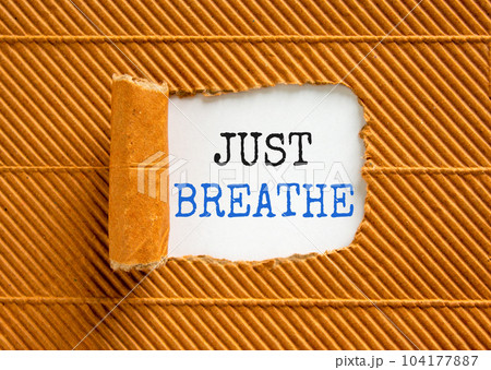 Just breathe and psychological symbol. Concept words Just breathe on beautiful white paper. Beautiful brown paper cardboard background. Business psychological and Just breathe concept. Copy space Just breathe and psychological symbol. Concept words Just breathe on beautiful white paper. Beautiful brown paper cardboard background. Business psychological and Just breathe concept. Copy space 104177887