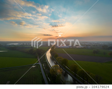 Dramatic sunset over canal Dessel Schoten aerial photo in Rijkevorsel, kempen, Belgium, showing the Dramatic sunset over canal Dessel Schoten aerial photo in Rijkevorsel, kempen, Belgium, showing the 104179024