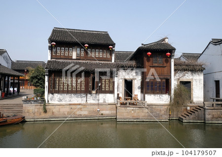 Traditional houses along the Grand Canal, ancient town of Yuehe in Jiaxing, Zhejiang Province, China 104179507