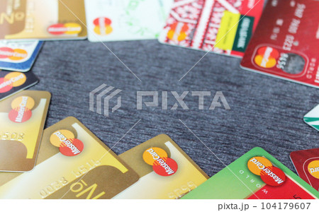 Close up of many Mastercard credit cards. Plastic bank cards 104179607