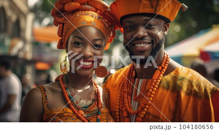 Beautiful african american woman in traditional dress and handsome black man smiling and looking at camera.AI Generative Beautiful african american woman in traditional dress and handsome black man smiling and looking at camera.AI Generative 104180656